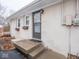 Rear house entrance with concrete steps at 6004 S Orinoco Ave, Indianapolis, IN 46227