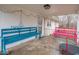 Covered porch with blue and pink benches, and toys at 6004 S Orinoco Ave, Indianapolis, IN 46227