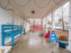 Covered porch with blue and pink benches, and toys at 6004 S Orinoco Ave, Indianapolis, IN 46227