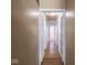 Long hallway with hardwood floors and access to bedrooms at 6004 S Orinoco Ave, Indianapolis, IN 46227