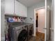 View of the laundry room with washer, dryer, and cabinets at 6004 S Orinoco Ave, Indianapolis, IN 46227