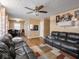 Living room features hardwood floors, a ceiling fan, and comfortable seating at 6004 S Orinoco Ave, Indianapolis, IN 46227