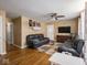 Living room with hardwood floors, ceiling fan, and ample natural light at 6004 S Orinoco Ave, Indianapolis, IN 46227