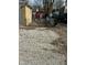 Large gravel backyard with storage shed and gated entrance at 6107 Hazelhatch Dr, Indianapolis, IN 46228