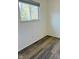 Empty bedroom with wood-look floors and window at 6107 Hazelhatch Dr, Indianapolis, IN 46228