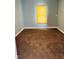 Empty bedroom with brown carpet and window at 6107 Hazelhatch Dr, Indianapolis, IN 46228