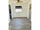 Bright dining room with hardwood floors and ceiling fan at 6107 Hazelhatch Dr, Indianapolis, IN 46228