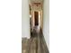 Clean hallway with hardwood floors and neutral walls at 6107 Hazelhatch Dr, Indianapolis, IN 46228