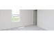 Spacious bedroom with a large window and grey carpet at 6322 Stone Side Dr, Plainfield, IN 46168
