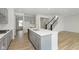 Modern kitchen with gray cabinets, island, and stainless steel appliances at 6322 Stone Side Dr, Plainfield, IN 46168