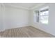 Bright and spacious living room with large windows and light hardwood floors at 6322 Stone Side Dr, Plainfield, IN 46168