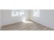 Well-lit spare bedroom with new vinyl plank flooring and neutral wall colors at 6322 Stone Side Dr, Plainfield, IN 46168