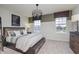 Cozy bedroom with a rustic feel, featuring a comfortable bed and plenty of storage at 6345 Stone Side Dr, Plainfield, IN 46168