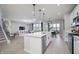 Modern kitchen with white cabinets, stainless steel appliances, and an island at 6345 Stone Side Dr, Plainfield, IN 46168