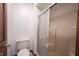 Bright bathroom featuring a toilet and glass enclosed shower with neutral walls at 8041 Halyard Way, Indianapolis, IN 46236