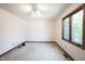 Bedroom with a large window providing natural light and plush carpet at 8041 Halyard Way, Indianapolis, IN 46236