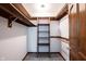 Walk-in closet with wooden shelving and railing for ample storage at 8041 Halyard Way, Indianapolis, IN 46236
