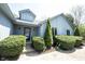 Close-up of the front of the house, showcasing the well-maintained landscaping and covered entryway at 8041 Halyard Way, Indianapolis, IN 46236