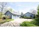 Charming single Gathering home with an attached two-car garage and a well-manicured front yard at 8041 Halyard Way, Indianapolis, IN 46236