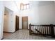 Grand two-story foyer with tiled floor, chandelier, and staircase to the upper level at 8041 Halyard Way, Indianapolis, IN 46236