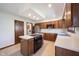 Traditional eat-in kitchen with a center island, stainless steel appliances, and laundry room at 8041 Halyard Way, Indianapolis, IN 46236