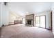 Bright living room with a stone fireplace, vaulted ceilings, and access to a second floor at 8041 Halyard Way, Indianapolis, IN 46236