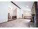 Spacious living room featuring a stone fireplace, sliding glass doors, and natural light at 8041 Halyard Way, Indianapolis, IN 46236