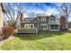 A vibrant backyard shows the home's back and its outdoor living and green space at 8072 Foxchase Dr, Indianapolis, IN 46256
