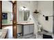 Bathroom with a white sink vanity, toilet and a tiled shower at 8072 Foxchase Dr, Indianapolis, IN 46256