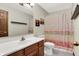 Updated bathroom with modern fixtures and a decorative shower curtain at 8072 Foxchase Dr, Indianapolis, IN 46256