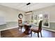 Dining area featuring wood floors and natural light at 8072 Foxchase Dr, Indianapolis, IN 46256