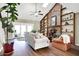 Inviting living room with vaulted ceiling, brick fireplace, and built-in bookshelves at 8072 Foxchase Dr, Indianapolis, IN 46256