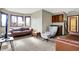 Inviting living area with comfortable seating, natural light, and a kitchenette area at 8072 Foxchase Dr, Indianapolis, IN 46256