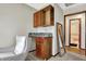 Living area features a kitchenette, comfortable seating, and access to the bathroom at 8072 Foxchase Dr, Indianapolis, IN 46256