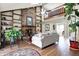 Spacious living room featuring a brick fireplace and access to the second story loft at 8072 Foxchase Dr, Indianapolis, IN 46256