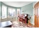 Charming sitting room with large windows, beautiful piano, and warm natural light for a cozy atmosphere at 8072 Foxchase Dr, Indianapolis, IN 46256