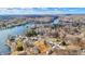 Aerial view of lakefront community with homes and wooded areas at 8598 S Riser Dr, Nineveh, IN 46164