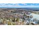Aerial view of lake community, showcasing homes and natural beauty at 8598 S Riser Dr, Nineveh, IN 46164