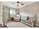 Bedroom featuring a crib, recliner, and cheerful decor at 8598 S Riser Dr, Nineveh, IN 46164