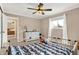 Bright bedroom with window, dresser, and view to another room at 8598 S Riser Dr, Nineveh, IN 46164
