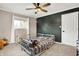 bedroom with a crib and geometric wall at 8598 S Riser Dr, Nineveh, IN 46164