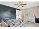 bedroom with a crib and built in dresser at 8598 S Riser Dr, Nineveh, IN 46164