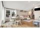 Bright dining area features hardwood floors and a charming white table with four chairs at 8598 S Riser Dr, Nineveh, IN 46164