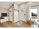 Bright entryway with wood floors, white door, and coat rack at 8598 S Riser Dr, Nineveh, IN 46164