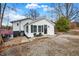 Charming white house with gray accents, a stone driveway, and a small front porch at 8598 S Riser Dr, Nineveh, IN 46164