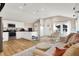 Open concept kitchen with white cabinets, stainless steel appliances and wood floors at 8598 S Riser Dr, Nineveh, IN 46164