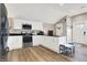 Modern kitchen with stainless steel appliances and white cabinets at 8598 S Riser Dr, Nineveh, IN 46164