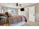 Main bedroom with carpeted floor, ceiling fan and access to bathroom at 8598 S Riser Dr, Nineveh, IN 46164
