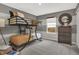 bedroom featuring bunk bed, modern decor, and window view at 8885 Lowell St, McCordsville, IN 46055