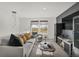Cozy living room with large window, comfortable seating, and stylish modern decor at 8885 Lowell St, McCordsville, IN 46055